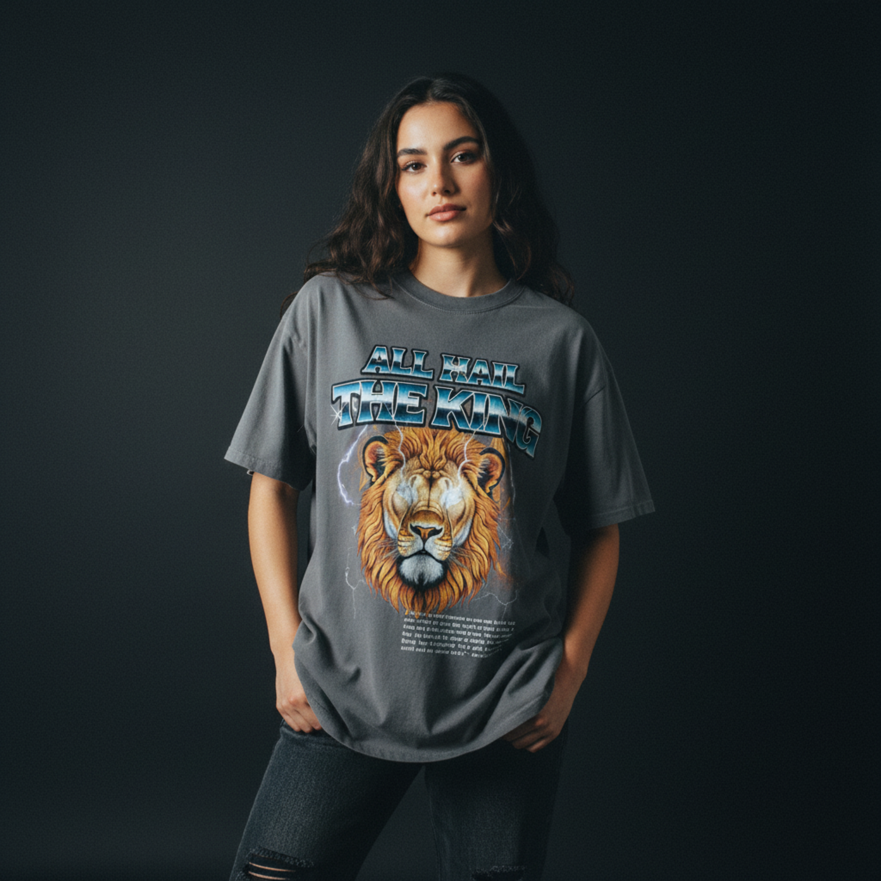 Person wearing a gray t-shirt with a lion graphic and text on a black background